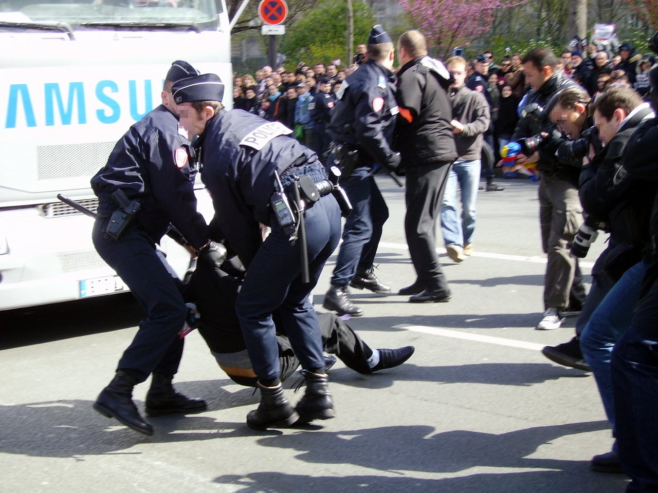 Police detain a man during a protest in Paris (file photo)